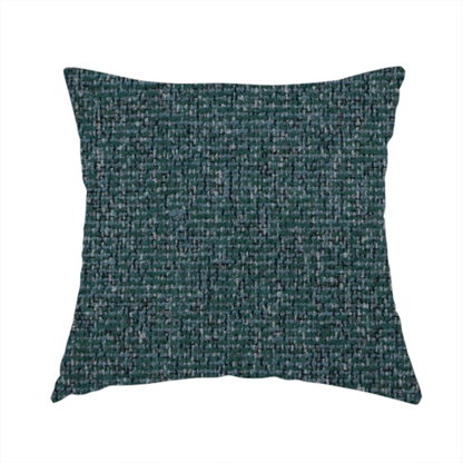 The fabric used to create this handmade cushion is a multi-tonal deep teal and grey textured woven fabric swatch.