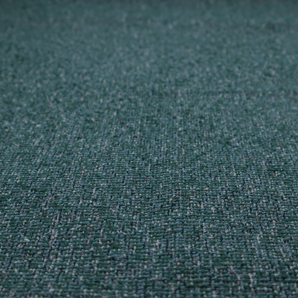 A multi-tonal deep teal and grey textured woven fabric swatch.