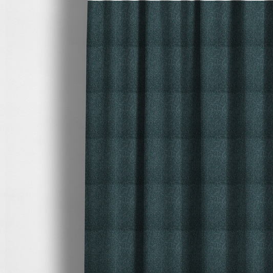 The fabric used to create these made-to-measure curtains is a multi-tonal deep teal and grey textured woven fabric swatch.