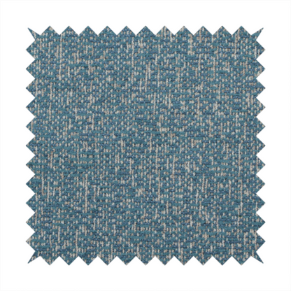 A multi-tonal blue and beige textured woven fabric swatch.