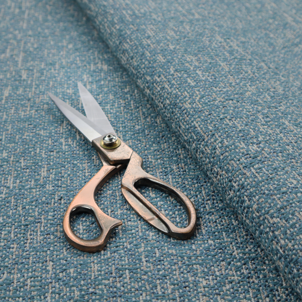 A multi-tonal blue and beige textured woven fabric swatch.