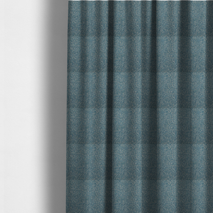The fabric used to create these made-to-measure curtains is a multi-tonal blue and beige textured woven fabric swatch.
