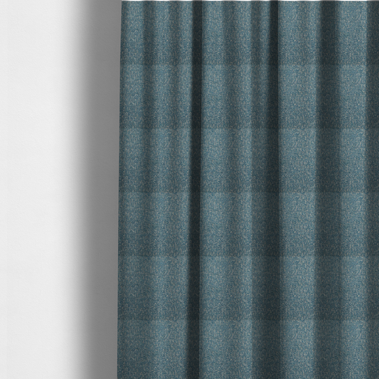 The fabric used to create these made-to-measure curtains is a multi-tonal blue and beige textured woven fabric swatch.