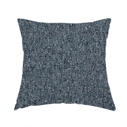 The fabric used to create this handmade cushion is a multi-tonal slate blue and grey textured woven fabric swatch.