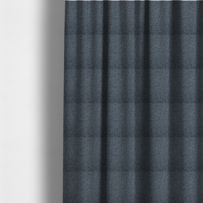 The fabric used to create these made-to-measure curtains is a multi-tonal slate blue and grey textured woven fabric swatch.