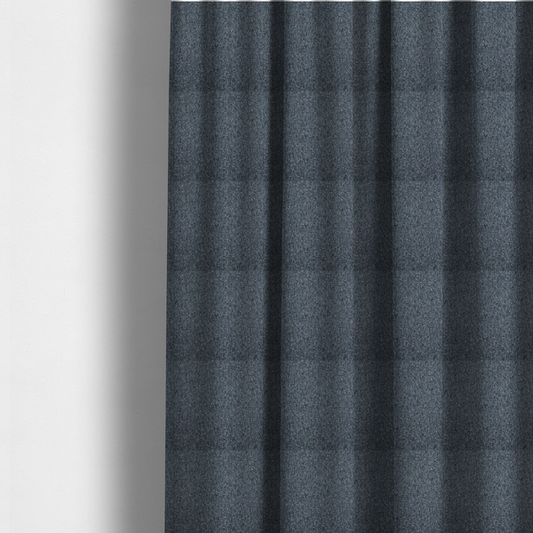 The fabric used to create these made-to-measure curtains is a multi-tonal slate blue and grey textured woven fabric swatch.