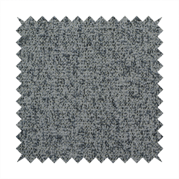 A multi-tonal grey and charcoal textured woven fabric swatch.