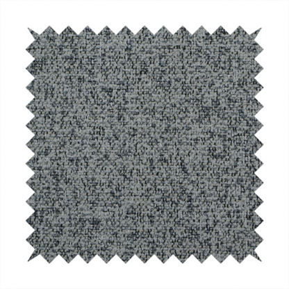 A multi-tonal grey and charcoal textured woven fabric swatch.