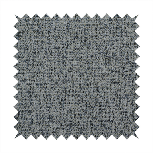 A multi-tonal grey and charcoal textured woven fabric swatch.