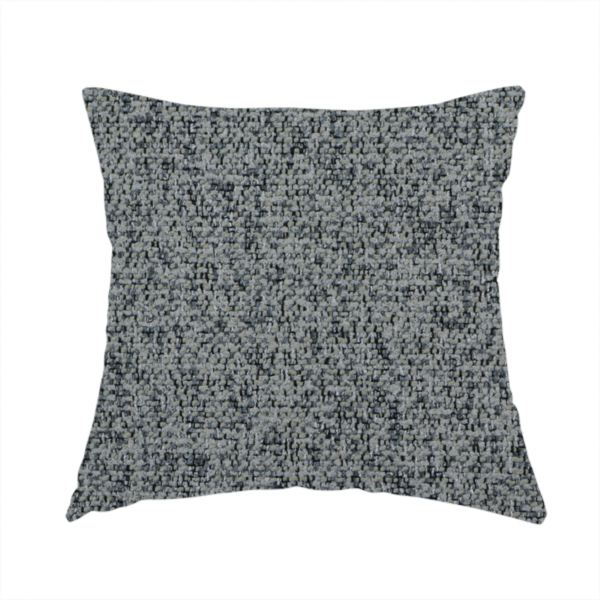 The fabric used to create this handmade cushion is a multi-tonal grey and charcoal textured woven fabric swatch.