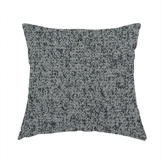 The fabric used to create this handmade cushion is a multi-tonal grey and charcoal textured woven fabric swatch.