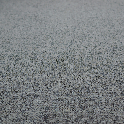 A multi-tonal grey and charcoal textured woven fabric swatch.