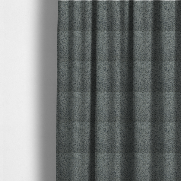The fabric used to create these made-to-measure curtains is a multi-tonal grey and charcoal textured woven fabric swatch.
