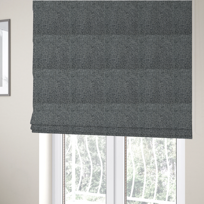 The fabric used to create these Roman blinds is a multi-tonal grey and charcoal textured woven fabric swatch.