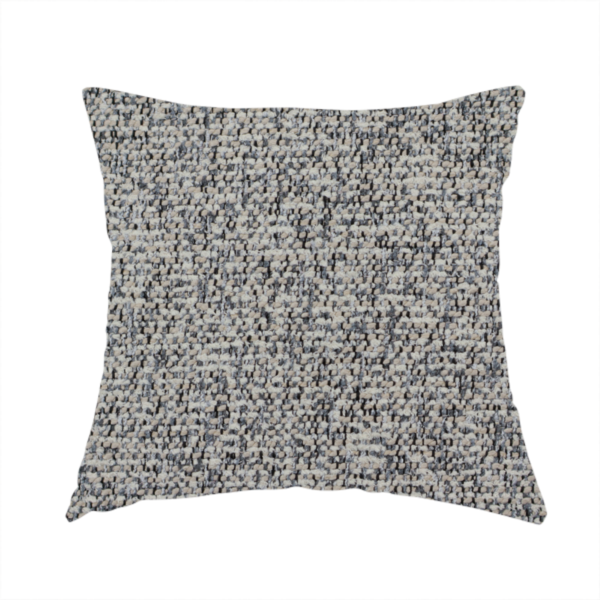 The fabric used to create this handmade cushion is a multi-tonal light grey and cream textured woven fabric swatch.