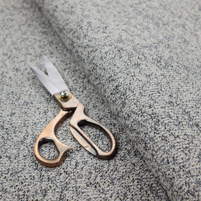 A multi-tonal light grey and cream textured woven fabric swatch.