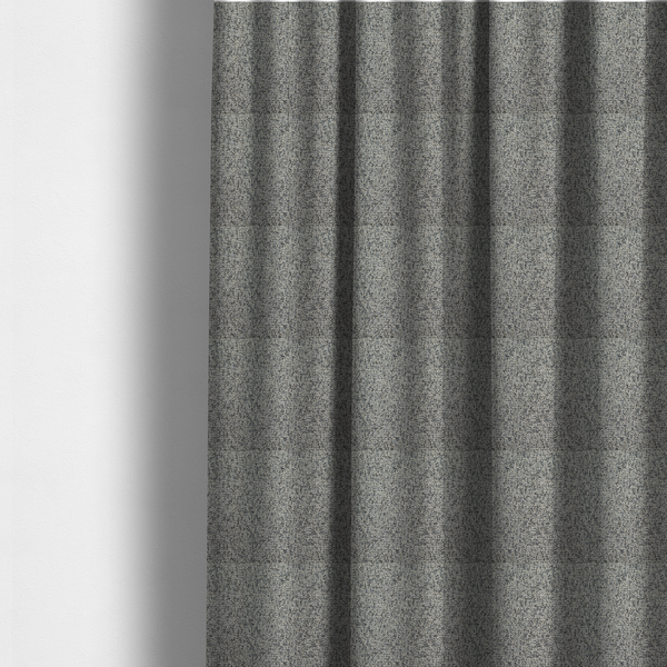 The fabric used to create these made-to-measure curtains is a multi-tonal light grey and cream textured woven fabric swatch.
