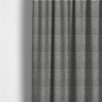 The fabric used to create these made-to-measure curtains is a multi-tonal light grey and cream textured woven fabric swatch.