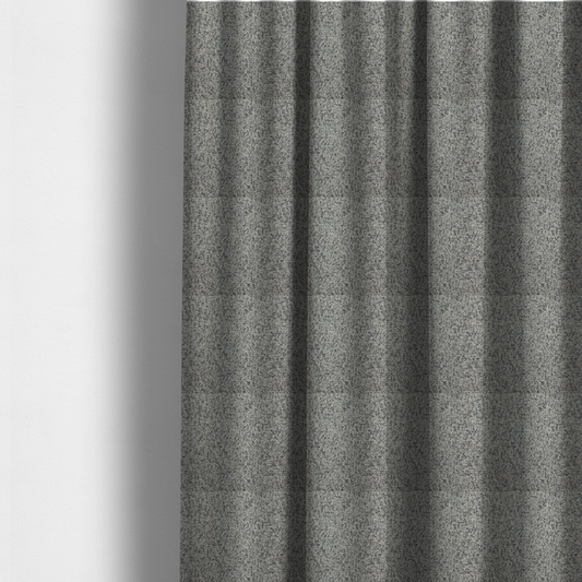 The fabric used to create these made-to-measure curtains is a multi-tonal light grey and cream textured woven fabric swatch.