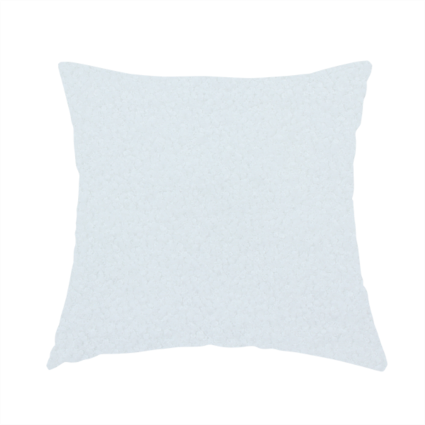 The fabric used to create this handmade cushion is a textured white fabric with a soft, pebbled fleece or Sherpa appearance.
