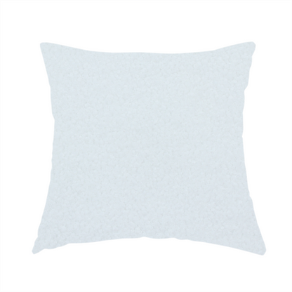The fabric used to create this handmade cushion is a textured white fabric with a soft, pebbled fleece or Sherpa appearance.