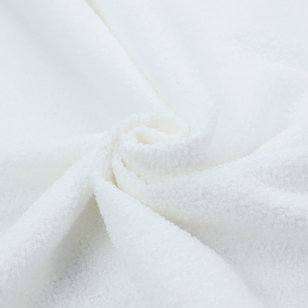 A textured white fabric with a soft, pebbled fleece or Sherpa appearance.