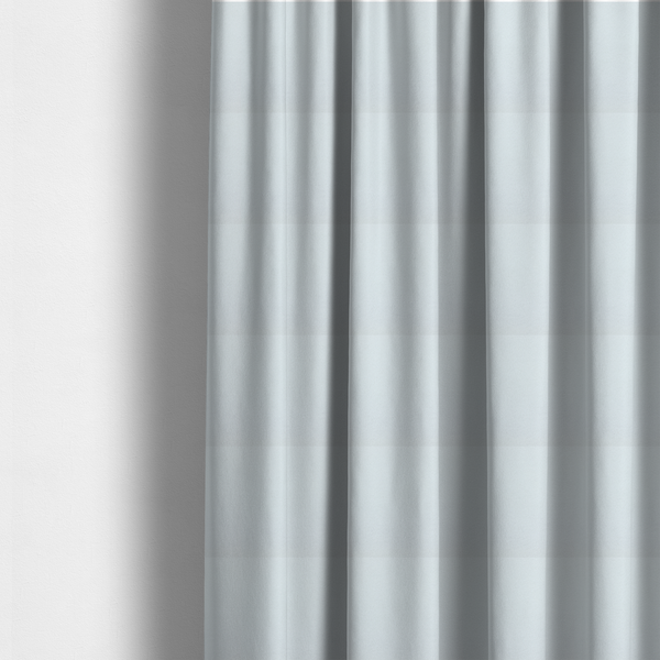The fabric used to create these made-to-measure curtains is a textured white fabric with a soft, pebbled fleece or Sherpa appearance.