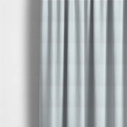 The fabric used to create these made-to-measure curtains is a textured white fabric with a soft, pebbled fleece or Sherpa appearance.