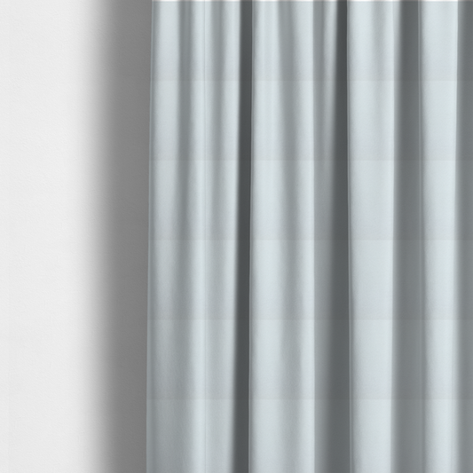 The fabric used to create these made-to-measure curtains is a textured white fabric with a soft, pebbled fleece or Sherpa appearance.