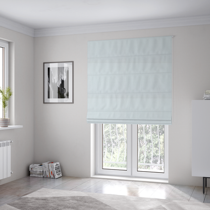 The fabric used to create these Roman blinds is a textured white fabric with a soft, pebbled fleece or Sherpa appearance.