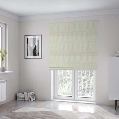 The fabric used to create these Roman blinds is a textured cream-coloured bouclé upholstery fabric.