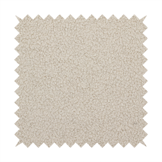 A textured beige bouclé upholstery fabric.