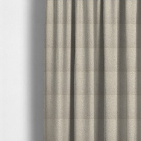 The fabric used to create these made-to-measure curtains is a textured beige bouclé upholstery fabric.