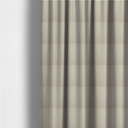 The fabric used to create these made-to-measure curtains is a textured beige bouclé upholstery fabric.