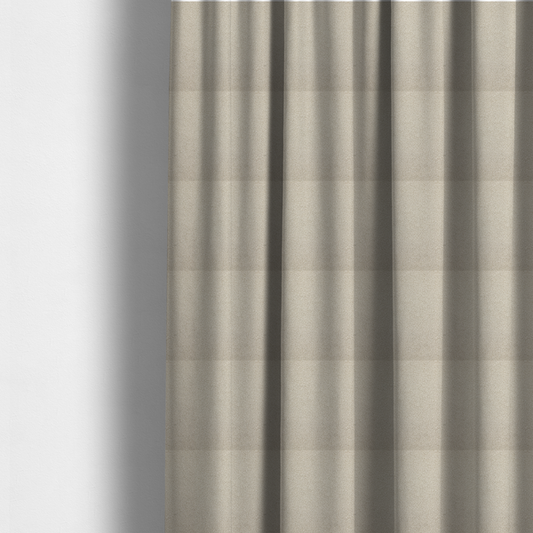 The fabric used to create these made-to-measure curtains is a textured beige bouclé upholstery fabric.
