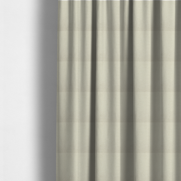 The fabric used to create these made-to-measure curtains is a textured ivory or light cream bouclé upholstery fabric.