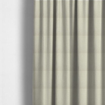 The fabric used to create these made-to-measure curtains is a textured ivory or light cream bouclé upholstery fabric.