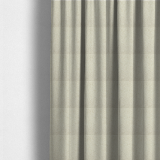 The fabric used to create these made-to-measure curtains is a textured ivory or light cream bouclé upholstery fabric.