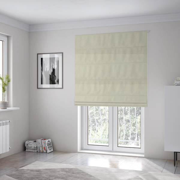 The fabric used to create these Roman blinds is a textured ivory or light cream bouclé upholstery fabric.