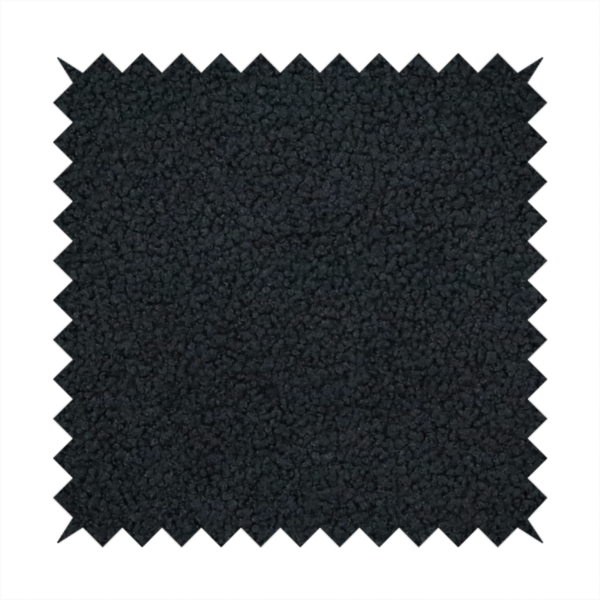 A textured charcoal black bouclé upholstery fabric.