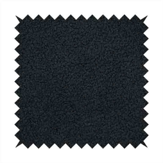 A textured charcoal black bouclé upholstery fabric.