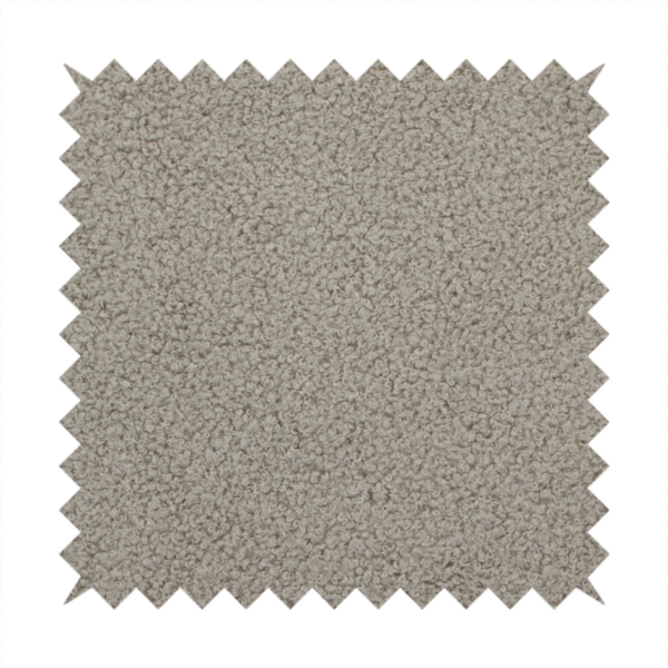 A textured taupe or light grey bouclé upholstery fabric.
