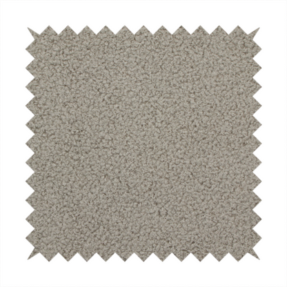 A textured taupe or light grey bouclé upholstery fabric.