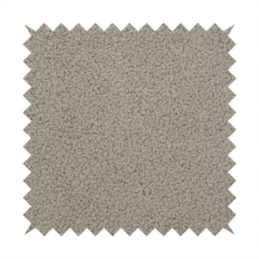 A textured taupe or light grey bouclé upholstery fabric.