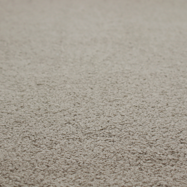 A textured taupe or light grey bouclé upholstery fabric.