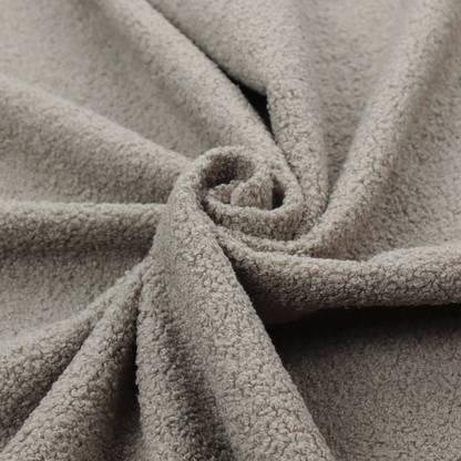 A textured taupe or light grey bouclé upholstery fabric.