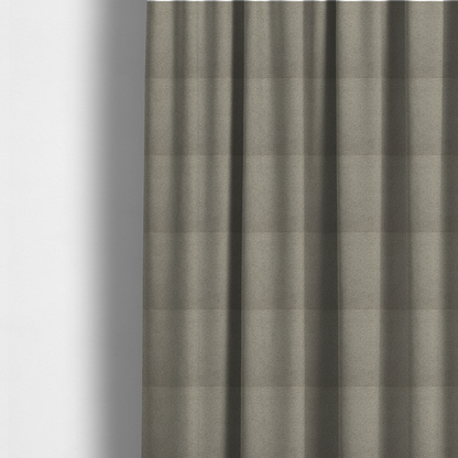 The fabric used to create these made-to-measure curtains is a textured taupe or light grey bouclé upholstery fabric.