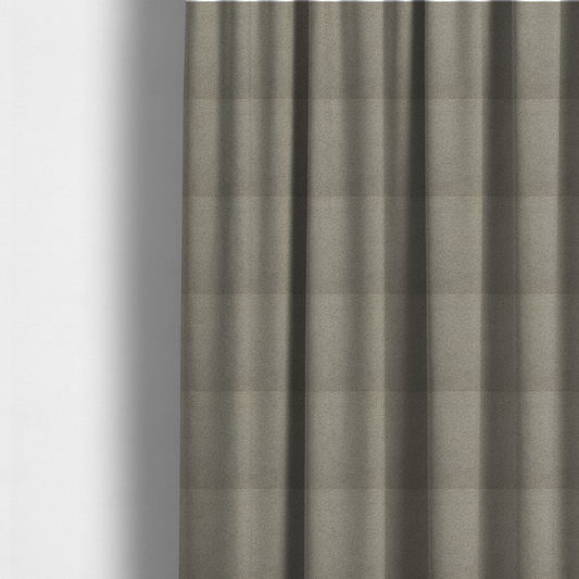 The fabric used to create these made-to-measure curtains is a textured taupe or light grey bouclé upholstery fabric.