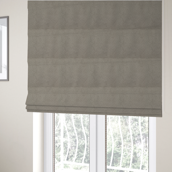 The fabric used to create these Roman blinds is a textured taupe or light grey bouclé upholstery fabric.