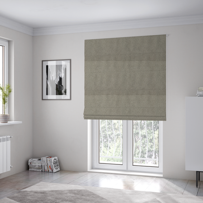 The fabric used to create these Roman blinds is a textured taupe or light grey bouclé upholstery fabric.